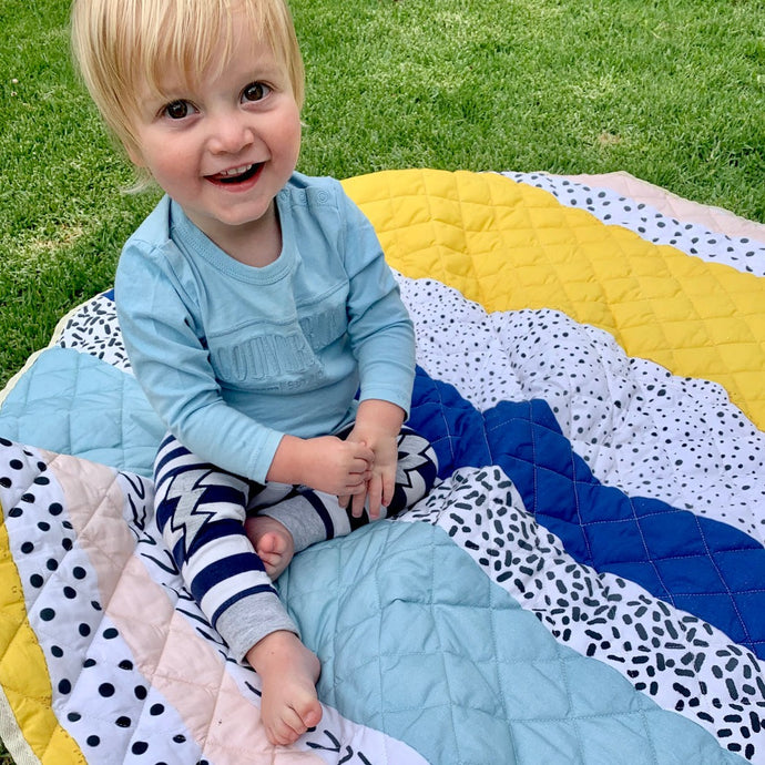 white black blue yellow spotted play mat
